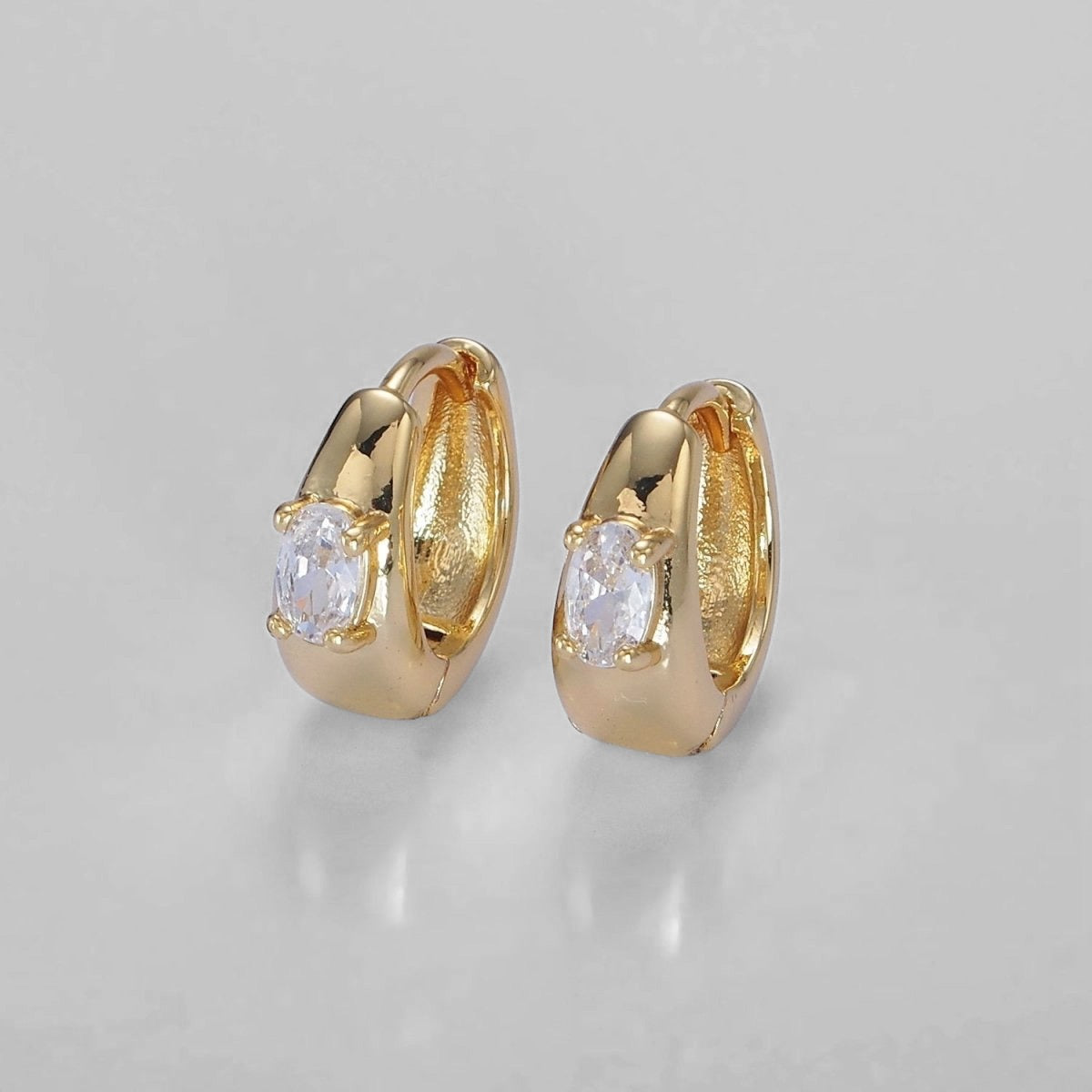 Oval CZ Dome Huggie Earrings