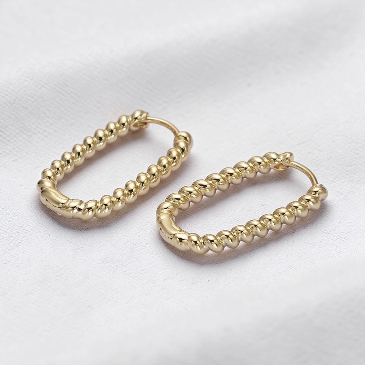 Twisted Croissant Oblong U shaped Hoop Earrings